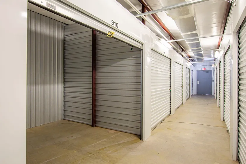 Indoor self storage units with secure roll-up doors and hallway access